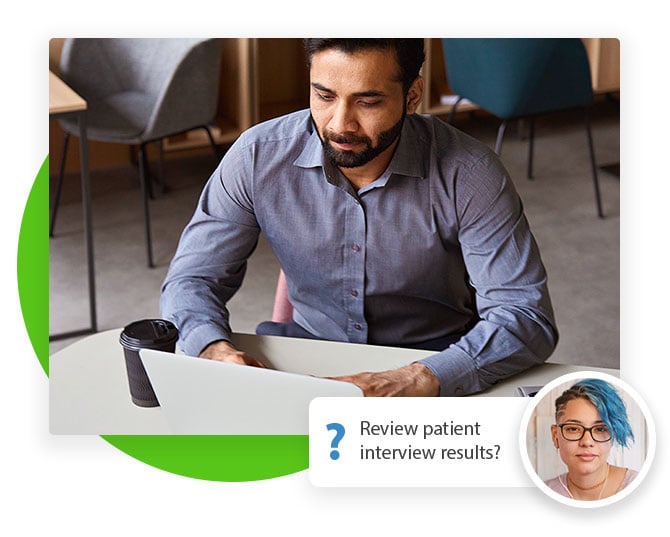 man on a laptop reviewing patient information